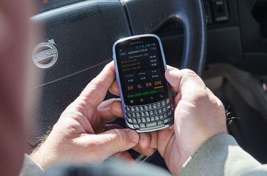 fleet driver with mobile phone in hand