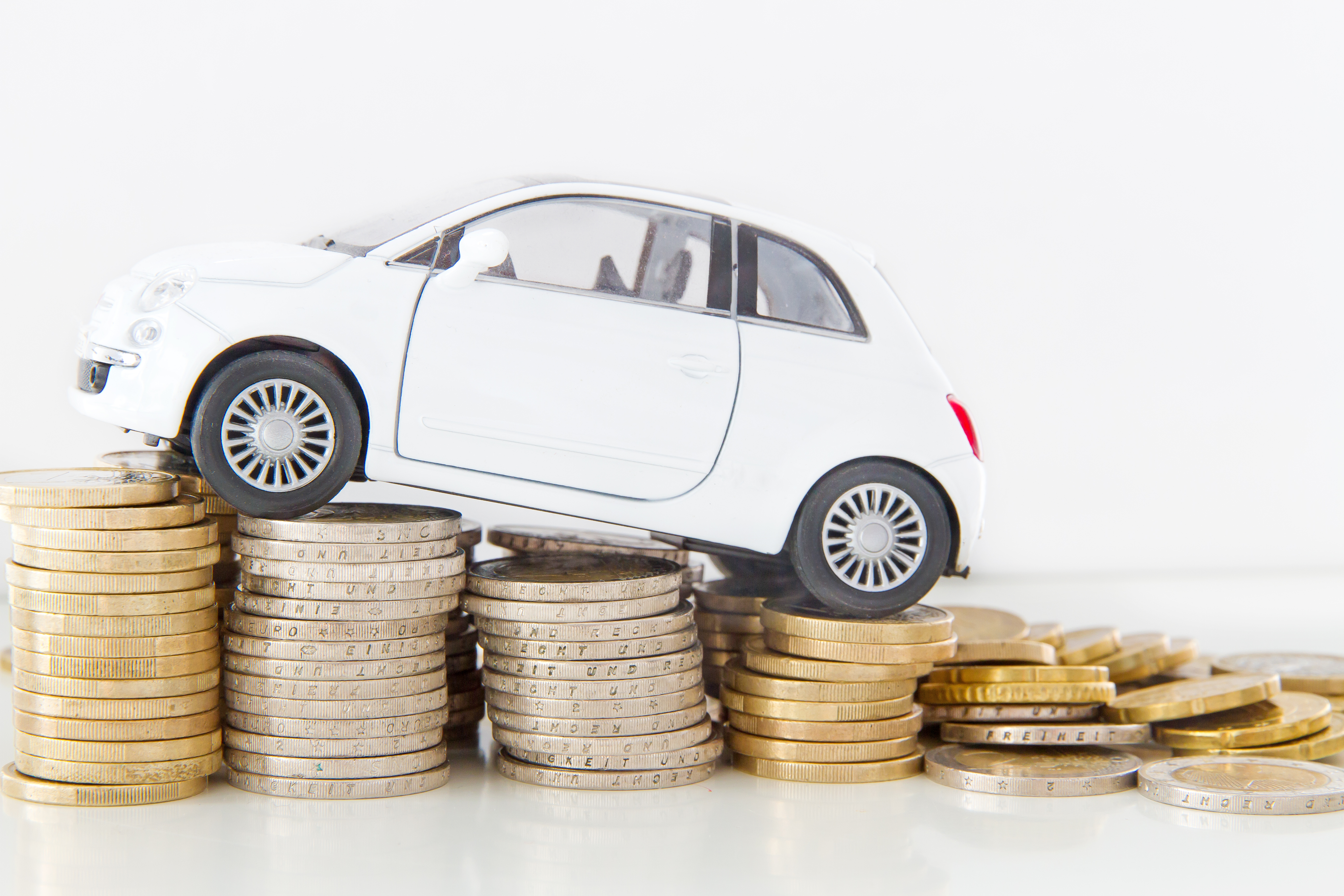 car on incline money coins