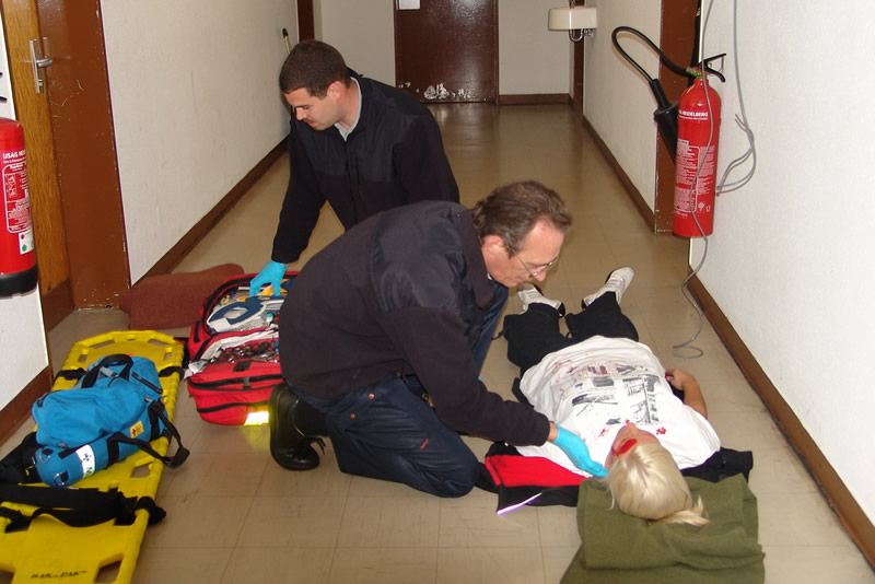 fire fighters practising first aid